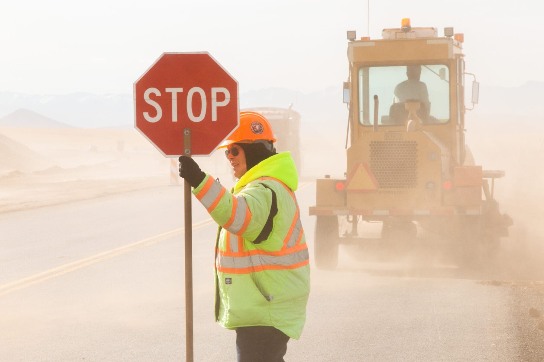 Practice safety in work zones and keep an eye out for construction workers guiding traffic